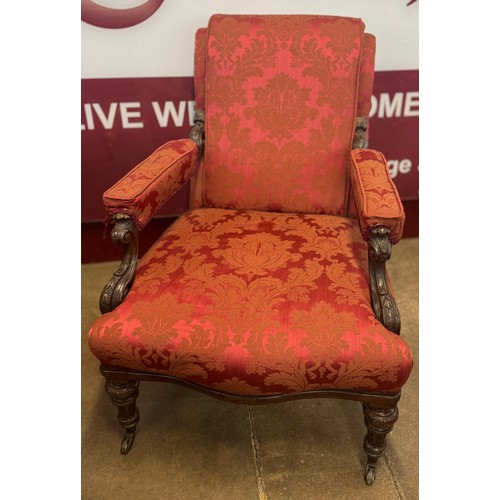 152 - An early Victorian carved mahogany and fabric upholstered country house open armchair