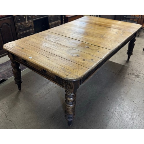 158 - A Victorian waxed and stained pine single drawer farmhouse table