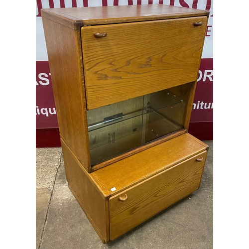 100 - A Stag oak and ash cocktail cabinet