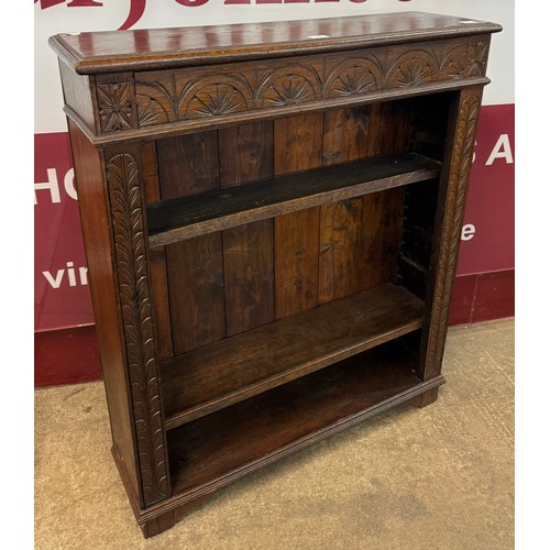 170 - An early 20th Century Jacobean Revival carved oak open bookcase