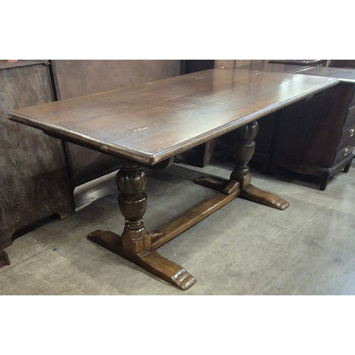 215 - An 18th Century style carved oak refectory table