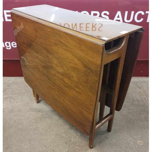 134 - A walnut and beech drop leaf table