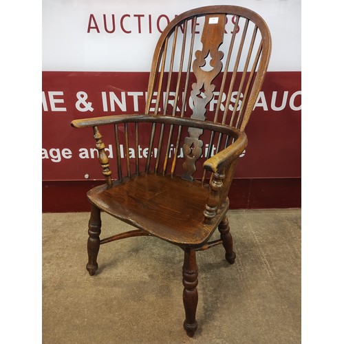 139 - A 19th Century elm high-back Windsor chair