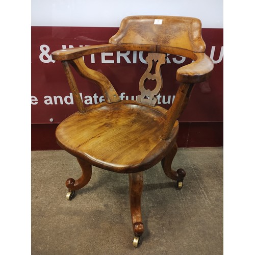 140 - A Victorian walnut desk chair