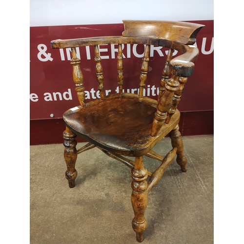 141 - A Victorian elm and beech smokers bow chair