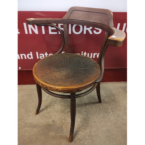 143 - An early 20th Century beech bentwood elbow chair