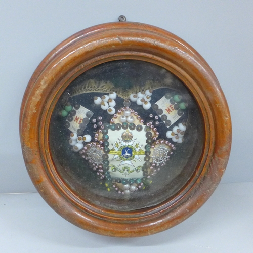 2008B - A WWI sweetheart cushion, Sherwood Foresters, Notts & Derby Regiment, in a circular wooden frame