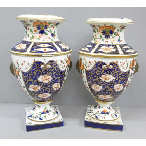 2008C - Two 19th Century Crown Derby Imari vases, one with restored rim, 23cm