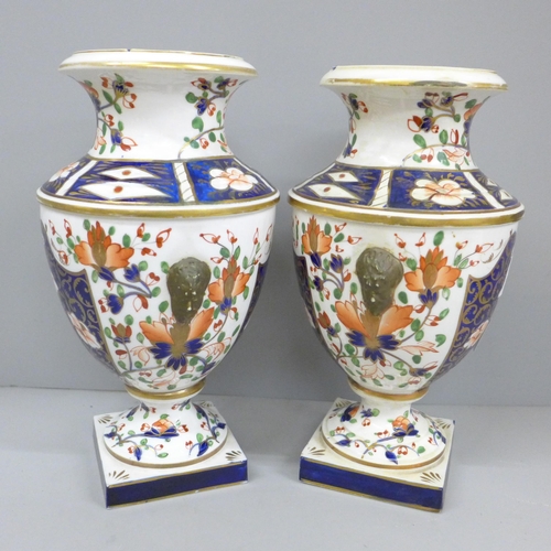 2008C - Two 19th Century Crown Derby Imari vases, one with restored rim, 23cm