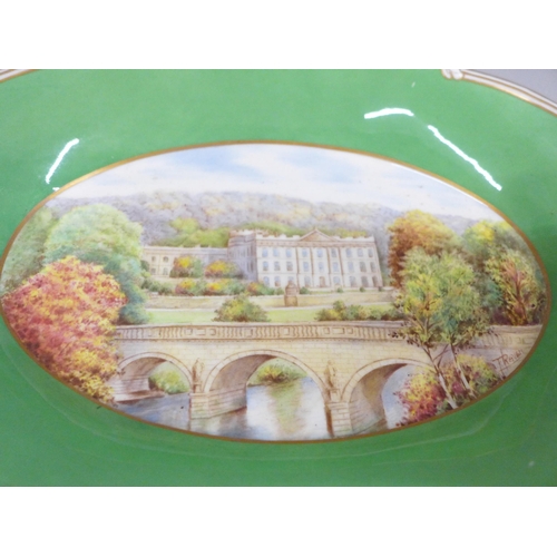 2008E - A Royal Crown Derby dish decorated in the centre with a scene of Chatsworth House, signed lower righ... 