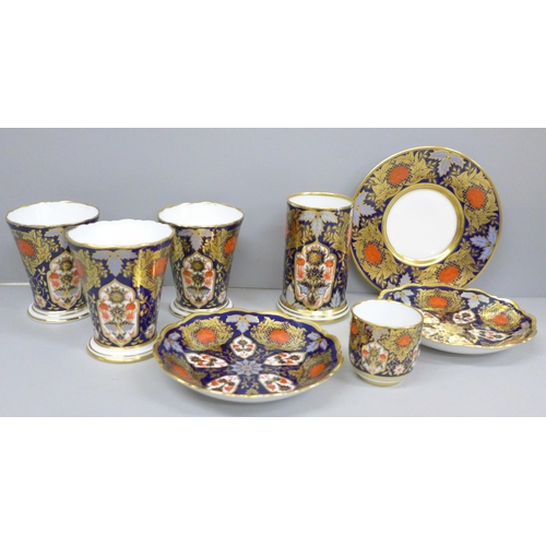 2062 - A collection of Hamilton Imari porcelain; two pin dishes, a saucer, four vases and a cup (one vase a... 