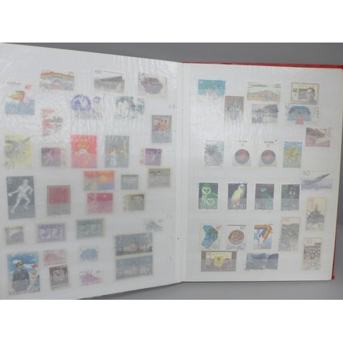 2069 - Stamps; a collection of mint and used China stamps (coiled dragons onwards) in 28 page stockbook