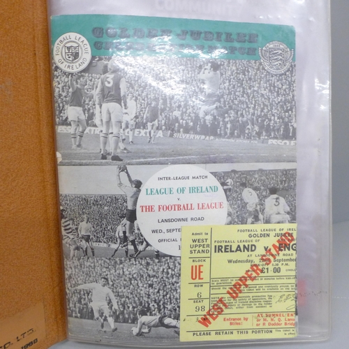 2073 - Football programmes; a file of football programmes with match tickets, including League of Ireland v... 