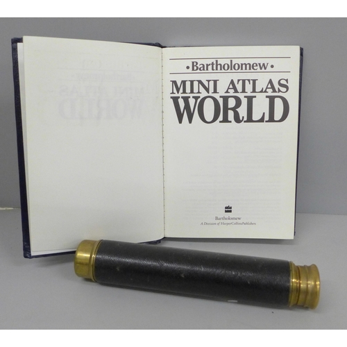 2074 - A telescope and British Airways mini atlas