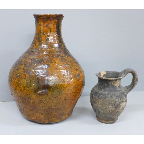 2075 - An early stoneware flask and a jug