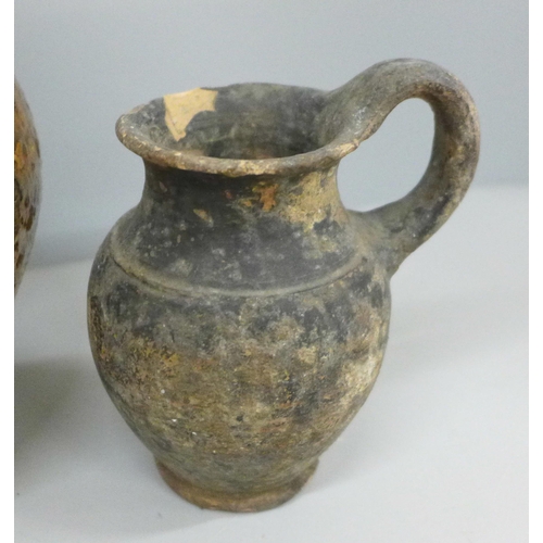 2075 - An early stoneware flask and a jug