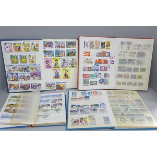 2087 - Four albums of worldwide stamps including Canada, Great Britain, Spain, Switzerland, etc.