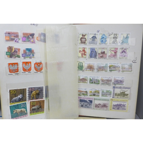 2087 - Four albums of worldwide stamps including Canada, Great Britain, Spain, Switzerland, etc.