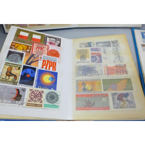 2087 - Four albums of worldwide stamps including Canada, Great Britain, Spain, Switzerland, etc.