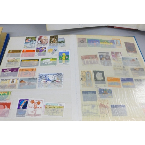 2087 - Four albums of worldwide stamps including Canada, Great Britain, Spain, Switzerland, etc.