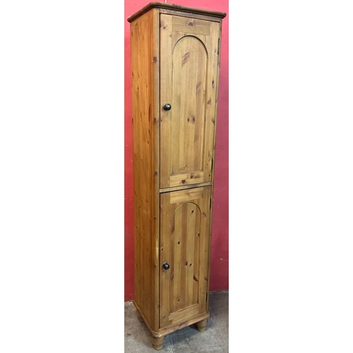 176 - A Victorian style pine two door cupboard