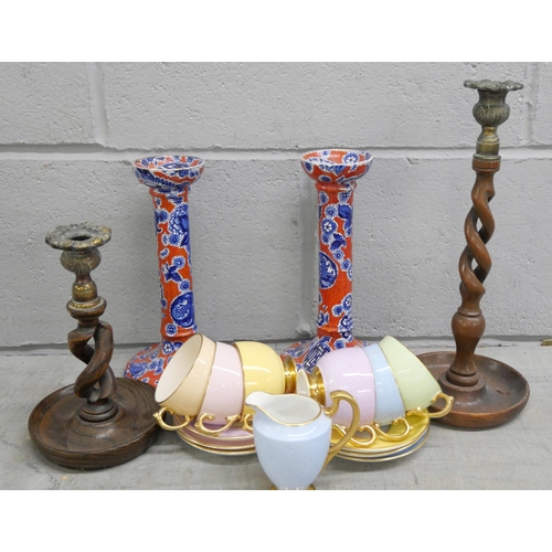 2293 - A pair of Burslem Pekin candlesticks and two other candlesticks and Grosvenor cups and saucers, some... 