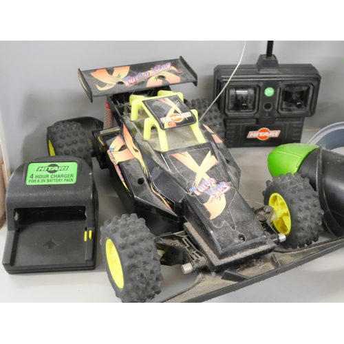 2302 - Two remote control vehicles, Tyco Terrain Twister and Hitari Turbo King, both with chargers and batt... 