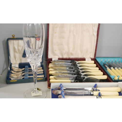 2304 - A pair of Waterford crystal flutes, boxed, together with a collection of cased cutlery sets **PLEASE... 