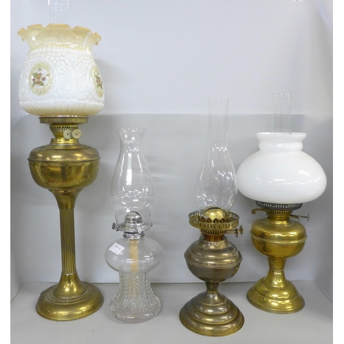 2322 - Four oil lamps **PLEASE NOTE THIS LOT IS NOT ELIGIBLE FOR IN-HOUSE POSTING AND PACKING**