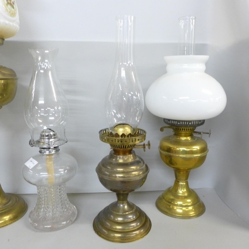 2322 - Four oil lamps **PLEASE NOTE THIS LOT IS NOT ELIGIBLE FOR IN-HOUSE POSTING AND PACKING**