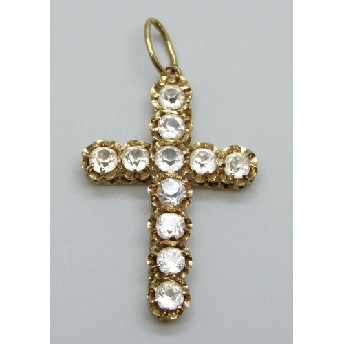 7001 - A yellow metal stone set cross pendant, tests as high carat gold, hanging loop marked 18ct, 3.8g