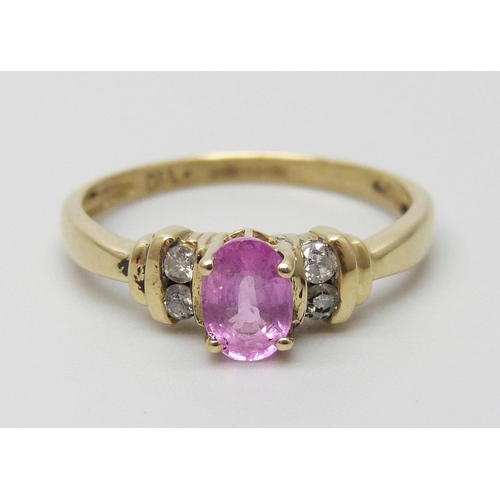 7002 - A 9ct gold, pink sapphire and diamond ring, 1.8g, N