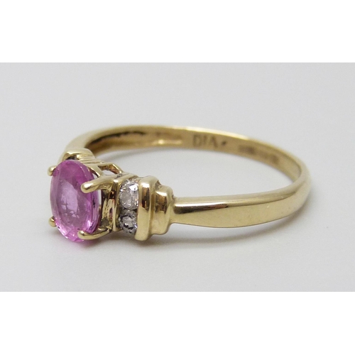 7002 - A 9ct gold, pink sapphire and diamond ring, 1.8g, N