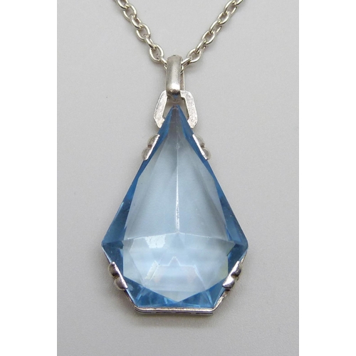 7013 - An .830 silver set blue stone Art Deco pendant and sterling silver chain, chain 60cm