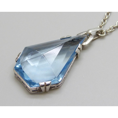 7013 - An .830 silver set blue stone Art Deco pendant and sterling silver chain, chain 60cm