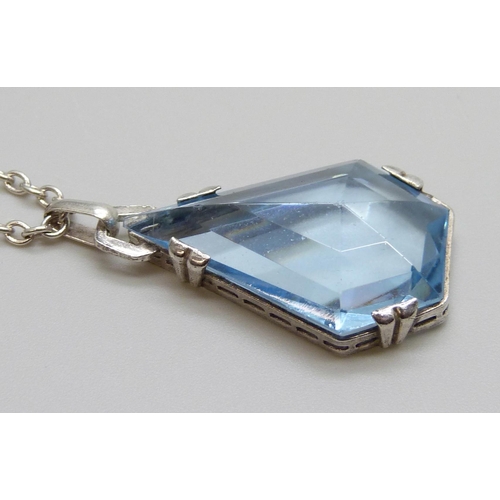 7013 - An .830 silver set blue stone Art Deco pendant and sterling silver chain, chain 60cm