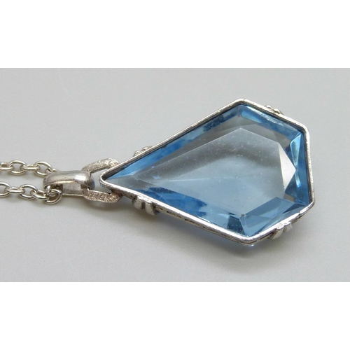 7013 - An .830 silver set blue stone Art Deco pendant and sterling silver chain, chain 60cm