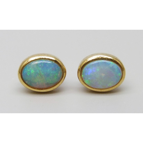 7015 - A pair of 18ct gold opal stud earrings, boxed, 2.4g