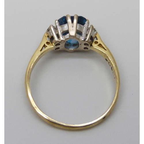 7021 - An 18ct gold, blue topaz and diamond ring, 3g, N