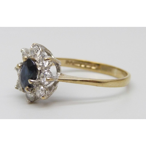 7026 - A 9ct gold, sapphire and white stone cluster ring, 1.5g, L