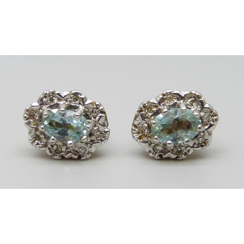 7030 - A pair of 9ct gold, blue topaz and diamond earrings, 2.7g