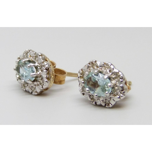 7030 - A pair of 9ct gold, blue topaz and diamond earrings, 2.7g