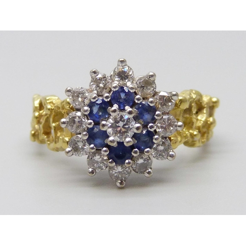 7031 - An 18ct gold, diamond and sapphire ring, 5.6g, L