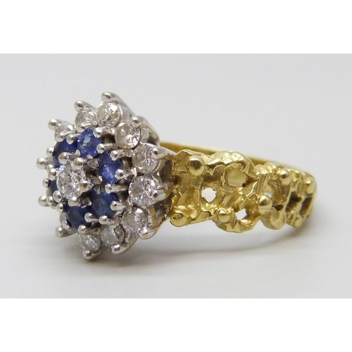 7031 - An 18ct gold, diamond and sapphire ring, 5.6g, L