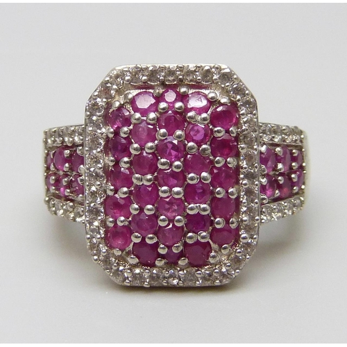 7033 - A silver gilt, ruby and zircon pave set ring, M