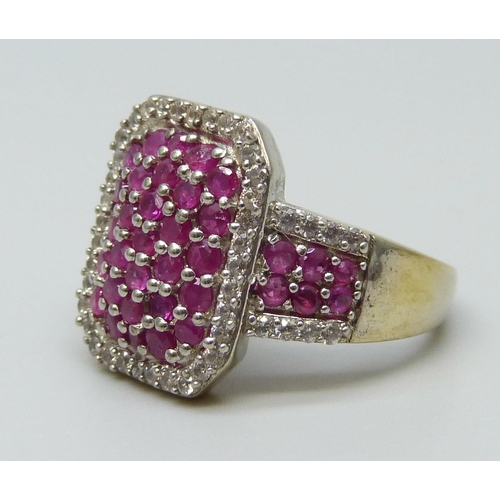 7033 - A silver gilt, ruby and zircon pave set ring, M