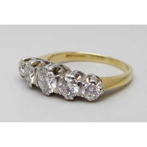 7034 - An 18ct gold, five stone diamond ring, diamond weight 1.22 carat, (stamped to band), G-H colour, SI1... 