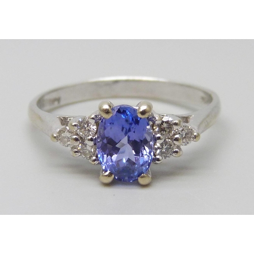 7039 - A 14ct/585 white gold, tanzanite and diamond ring, size O, 2.6g