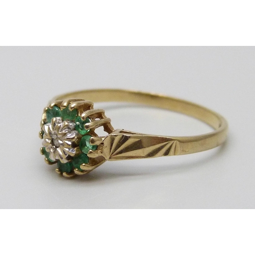 7041 - A 9ct gold, diamond and emerald ring, 1.5g, P