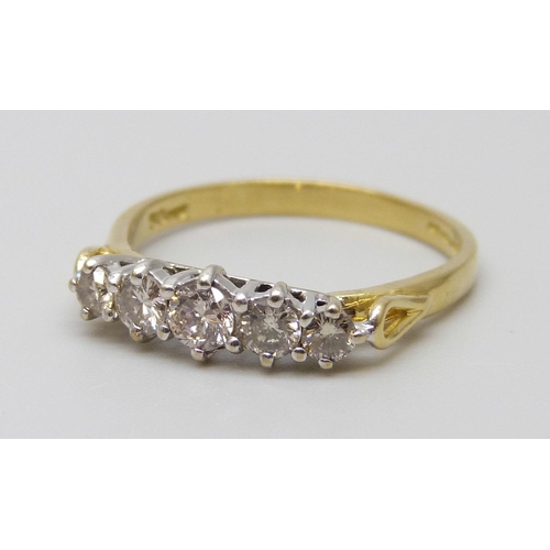 7042 - An 18ct gold five stone diamond ring, diamond weight 0.50 carat stamped to band, size N, 2.2g